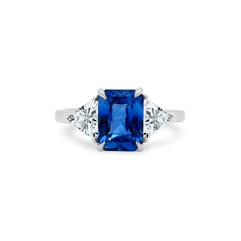 Women's rings gentle-glow-Emerald Cut Sapphire with Trillion Cut Diamond Side Stones