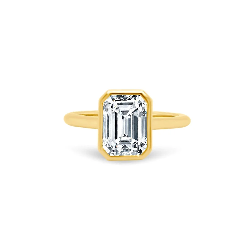 Women's rings slim-profile-North South Bezel Set Emerald Cut Solitaire